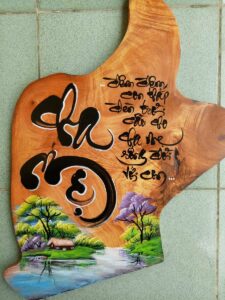 Thu-phap-tren-go-qua-tang-y-nghia